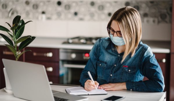 coronavirus-business-woman-working-home-wearing-protective-mask-quarantine-stay-home-girl-learns-using-laptop-computer-home-office-freelance-writing-typing_180731-146